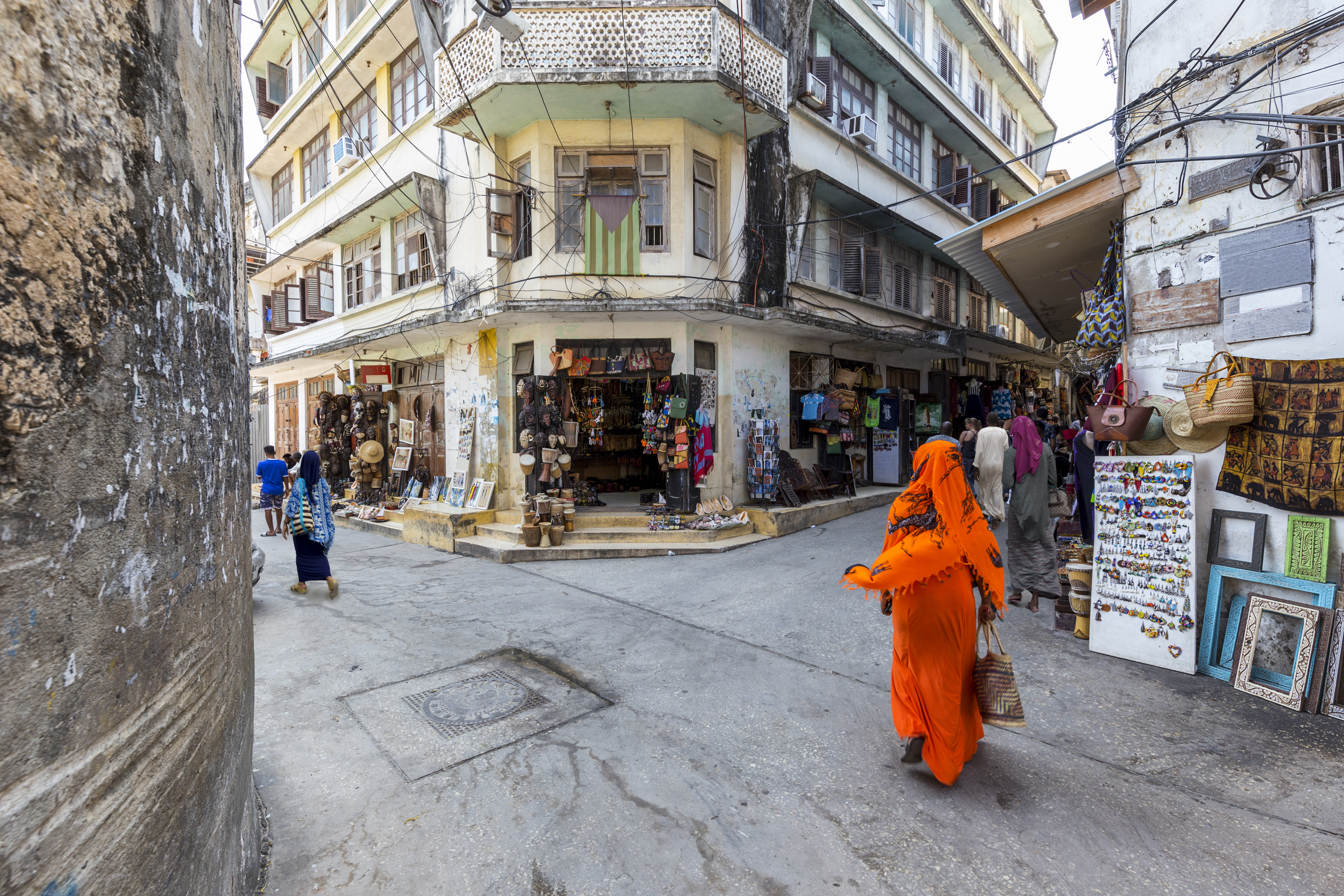 corner-street-scene-in-the-city-of-stone-town-zanzibar-town-full-of-life-and-activity_283365581.jpeg