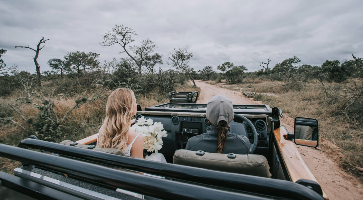 Bride being escorted to Safari wedding