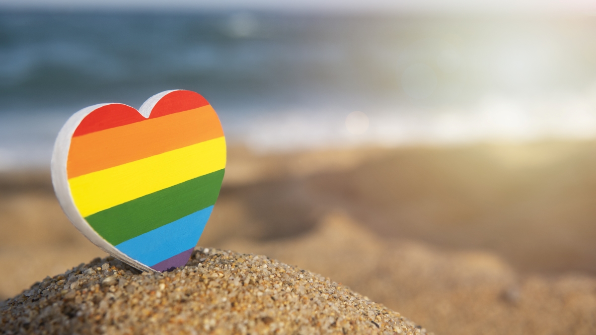 Rainbow heart on beach