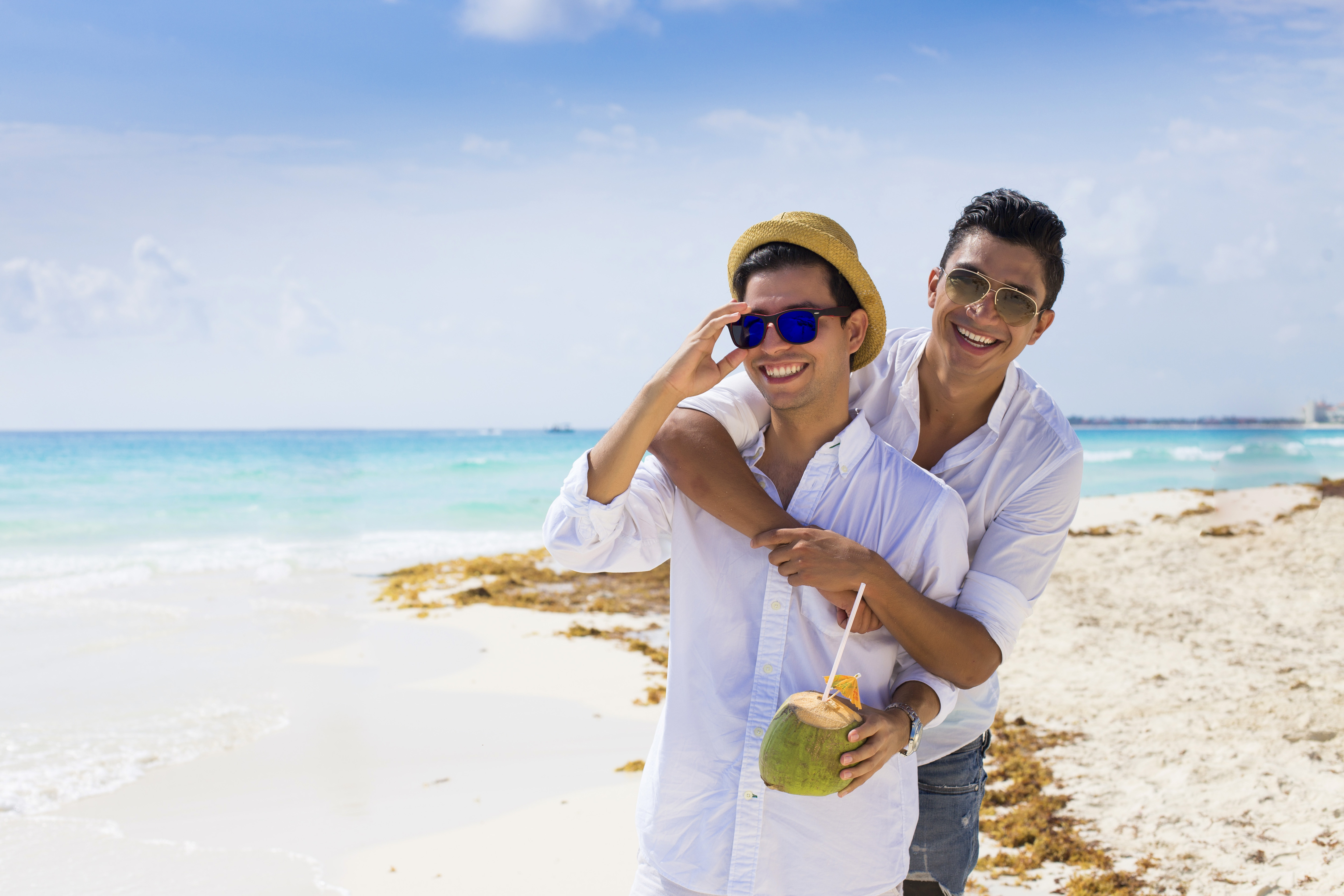 couple-of-men-enjoying-at-the-beach_211552951.jpeg