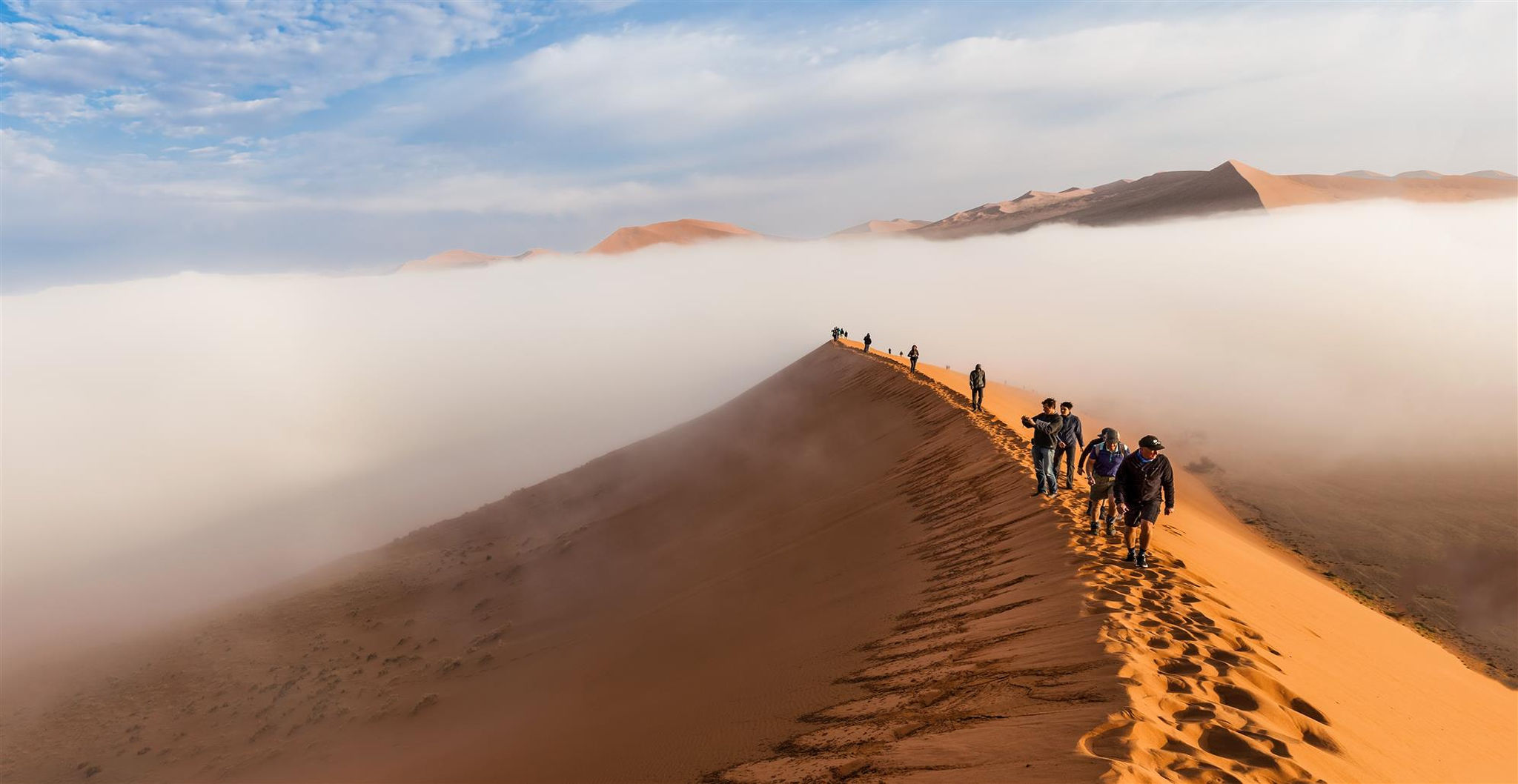 tourists-climbing-up-dune-early-morning-sossusvlei-namibia-desertjpg-1.jpg