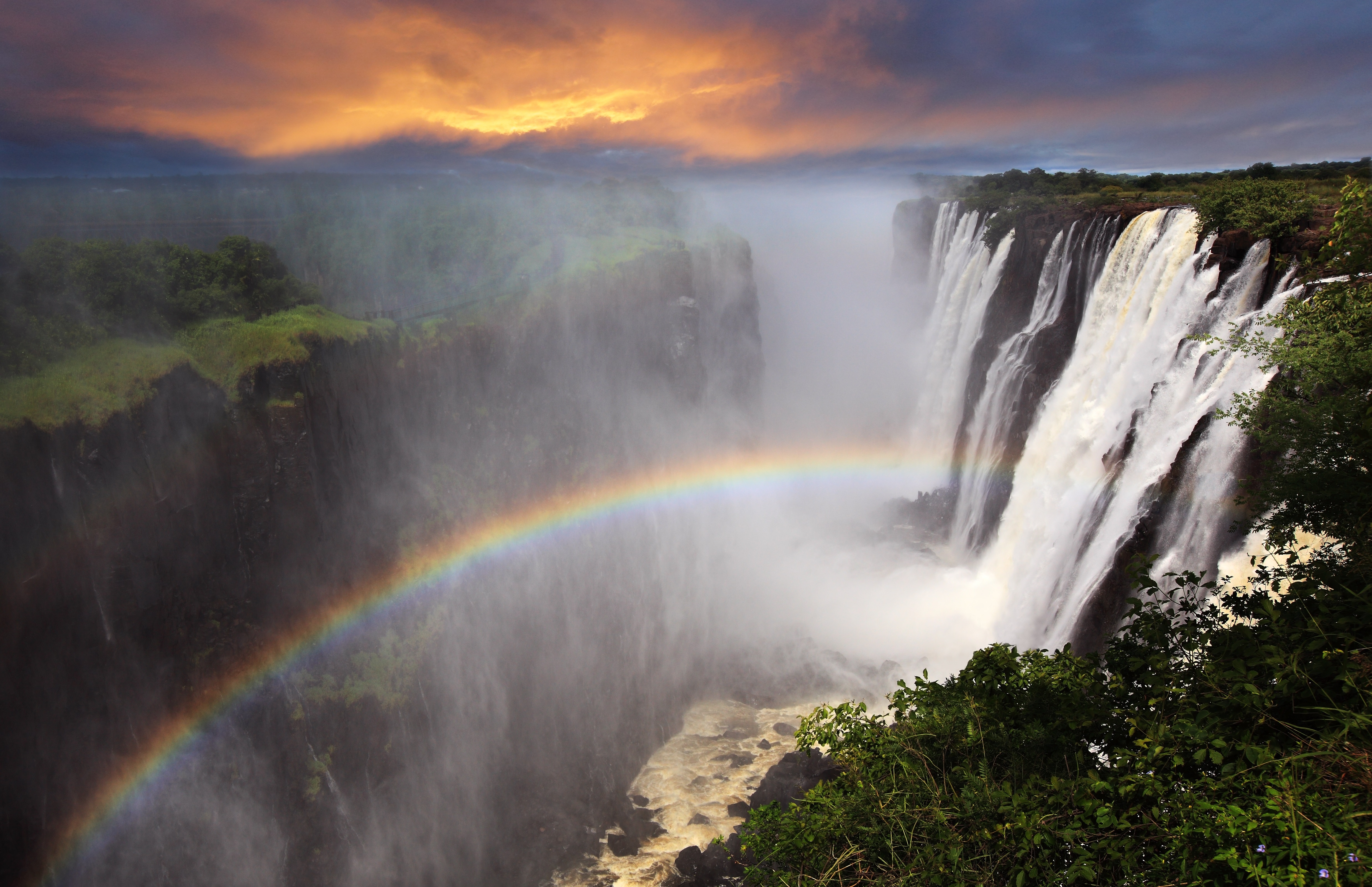 victoria-falls-sunset-with-rainbow-zambia_231816934.jpeg