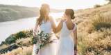 Lesbian wedding couple in white dresses