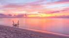 Sunset over the beach at Lux le Morne