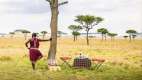 Maasai man standing by tree in Kenya