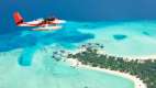 Sea plane flying above the Maldive islands